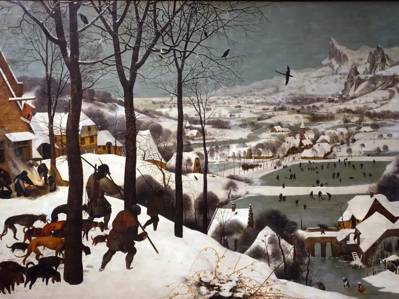 Bruegel's Hunters in the Snow showing the dark silhouettes of hunters and dogs in the foreground leading the eye diagonally down into the snowy valley below