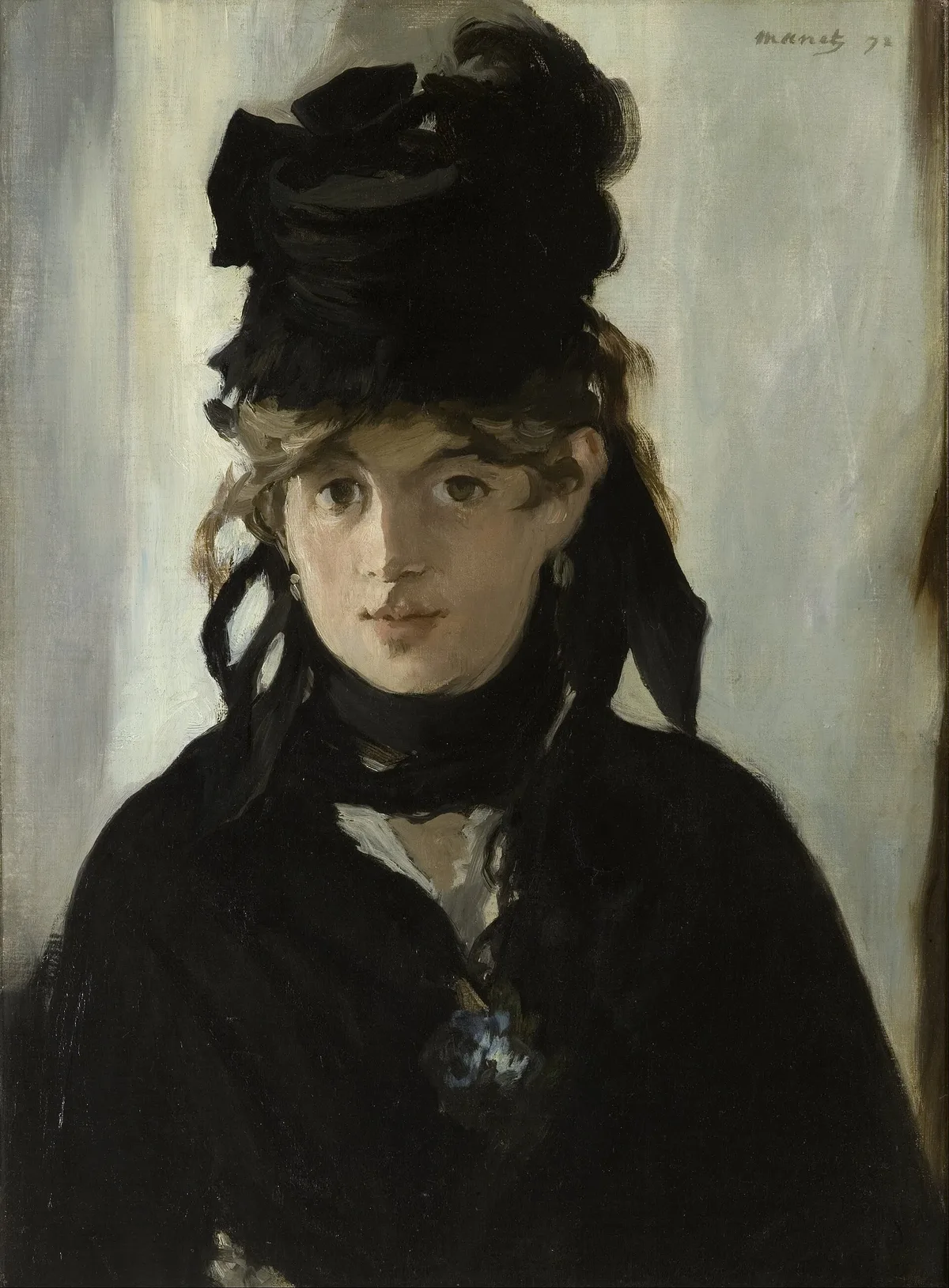 Édouard Manet's portrait of Berthe Morisot with a Bouquet of Violets — the illuminated face sits against deep dark clothing and a near-black background, demonstrating focused value contrast