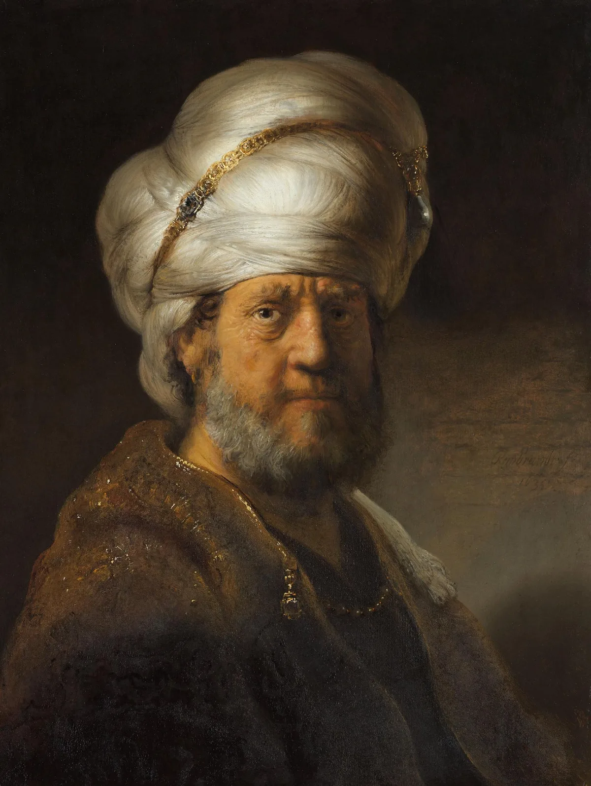Rembrandt van Rijn's Man in Oriental Dress, 1635, showing a face emerging from deep shadow — a masterclass in value control and chiaroscuro